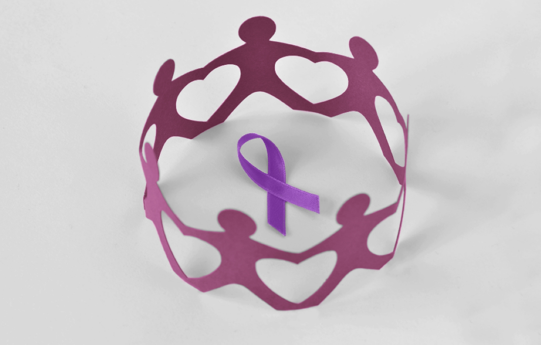 A circle of purple figures in the middle of them is a purple ribbon. There is a white background